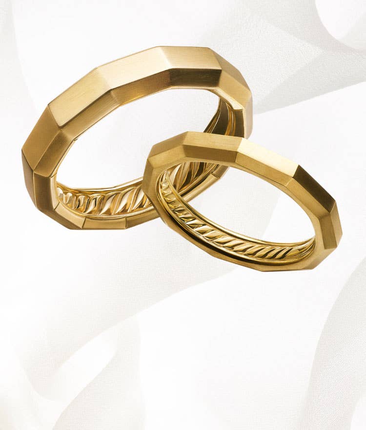 An image of two yellow gold faceted David Yurman band rings.