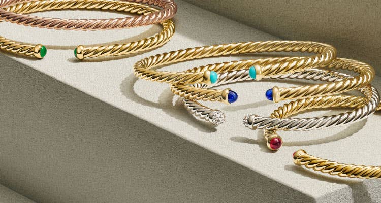 An image of 6 CableSpira bracelets in gold.