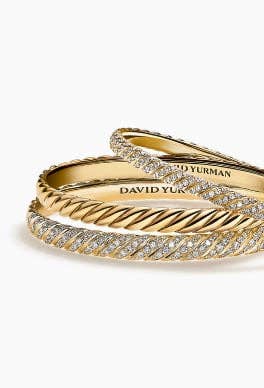 Three David Yurman Sculpted Cable bracelets in yellow gold.