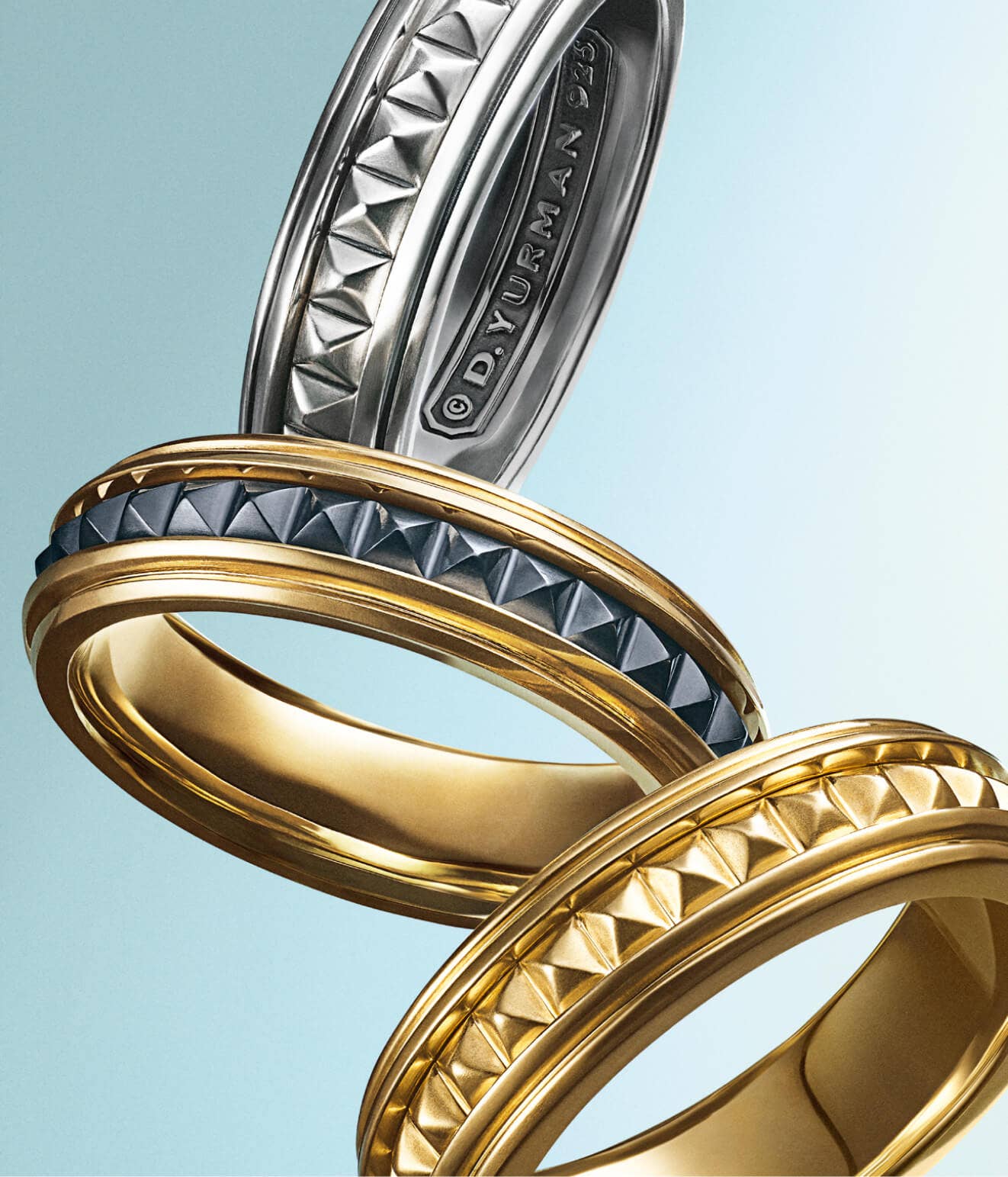 An image of three David Yurman Pyramid bracelets.