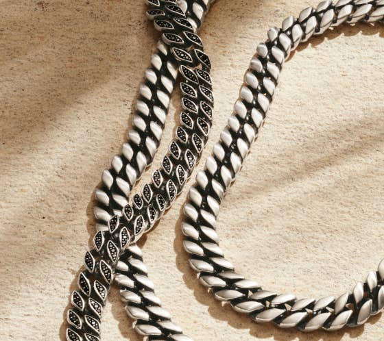 A collection of 3 David Yurman curb chain necklaces.