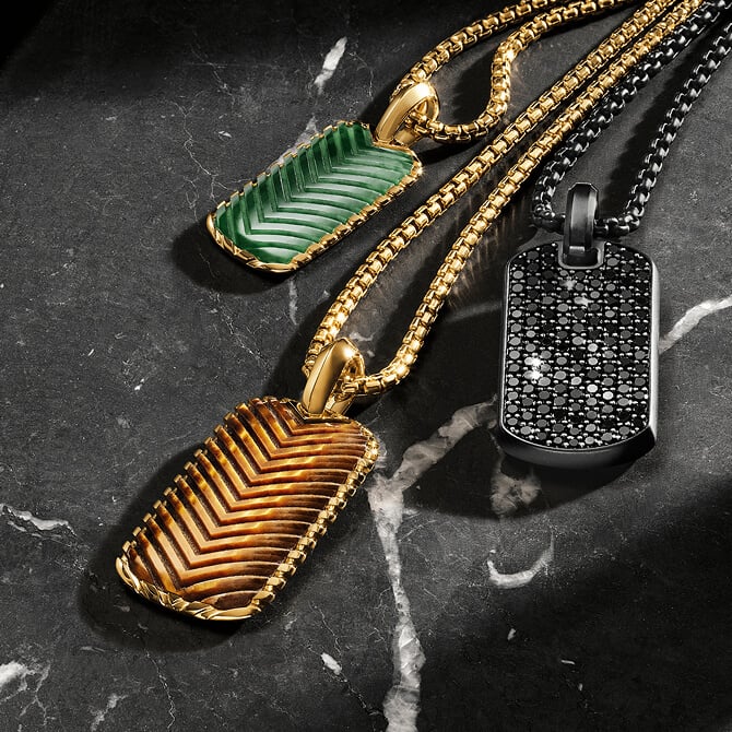 Three David Yurman Chevron tags on chains.