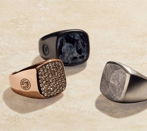 A collection of 3 David Yurman rings.