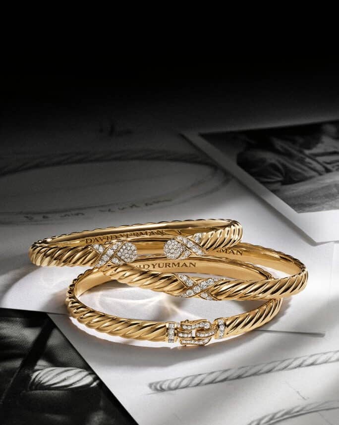 Three David Yurman Sculpted Cable bracelets.