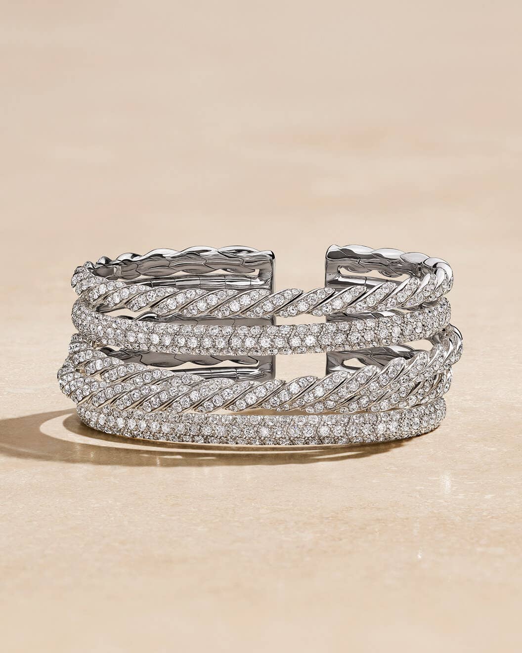 A 17mm gold and a 24mm silver David Yurman Cable Edge&#174; Cuff Bracelet.