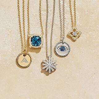 Five David Yurman necklaces with pendants.