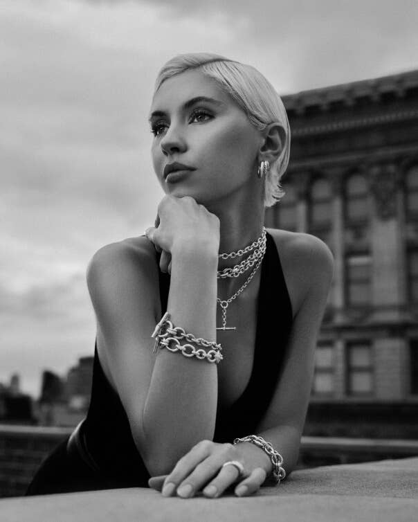Iris Law wearing David Yurman Mercer jewelry outside.