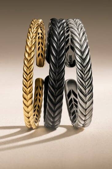 Three David Yurman men's bracelets.