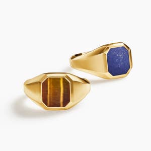 Two Gold David Yurman signet rings.