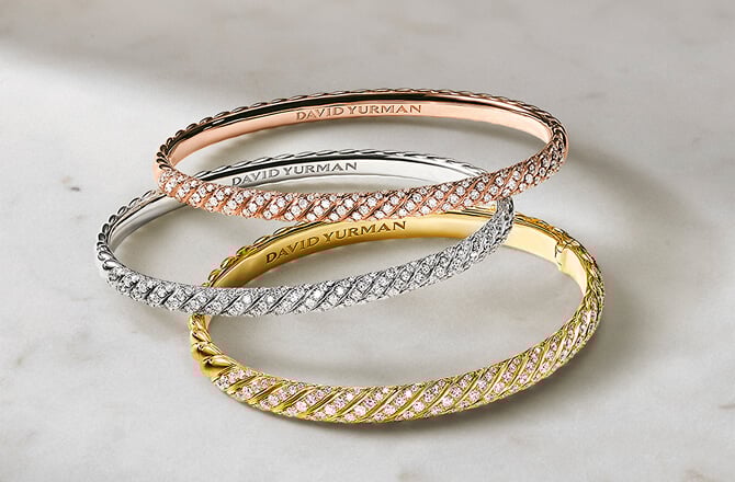 Three David Yurman bangle bracelets.