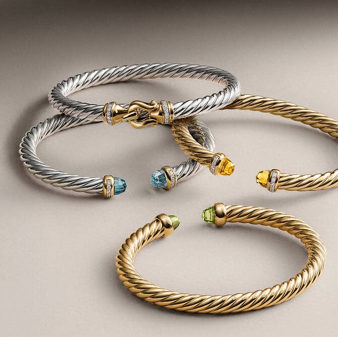 A Mix of David Yurman Silver and Gold Bracelet Cuffs