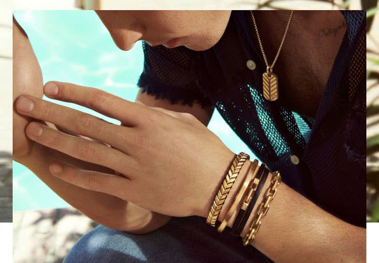 David Yurman spring campaign featuring Shawn Mendes wearing select gold bracelets and a gold Chevron collection tag on a necklace.