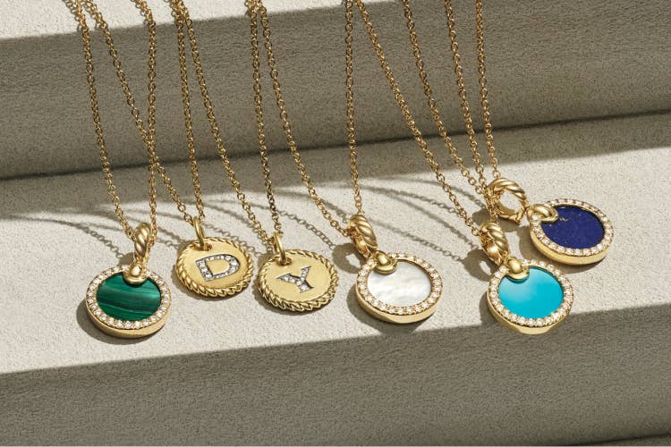 Graduation gifts featuring David Yurman necklaces with amulets.