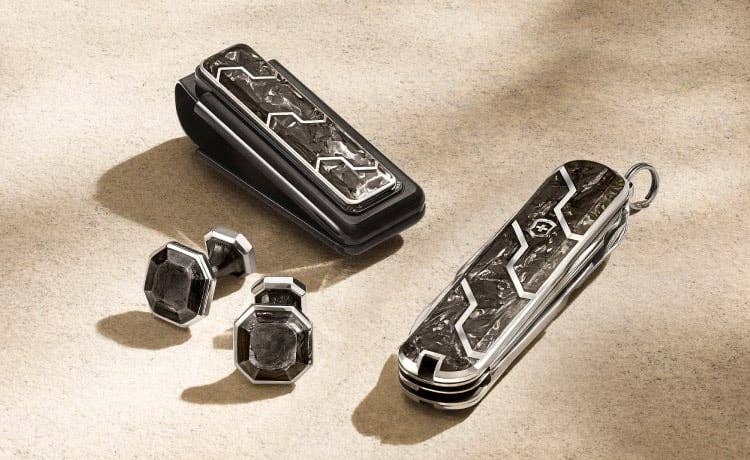 An image of forged carbon cufflinks, money clip and pocket knife.