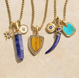 A variety of David Yurman Amulets featuring different stones and crystals.