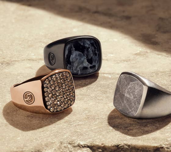 A collection of 3 David Yurman rings.