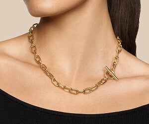 Model wearing David Yurman necklaces.