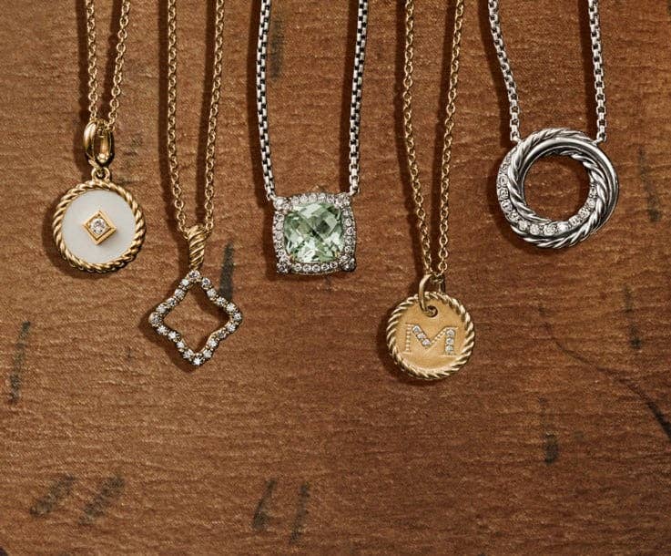 An image of five pendant necklaces.