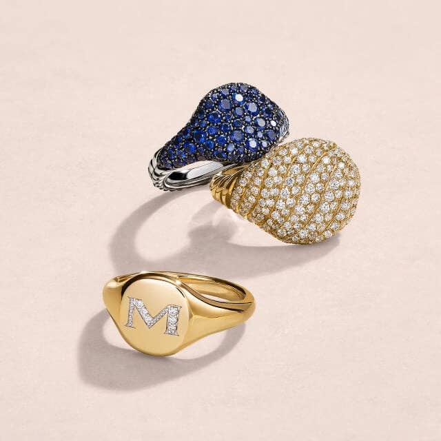 Three David Yurman pinky rings in color and silver.