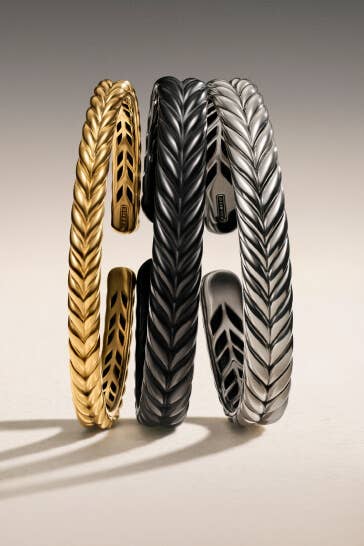 Three David Yurman men's bracelets.