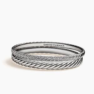 Two David Yurman bracelets in White Gold.