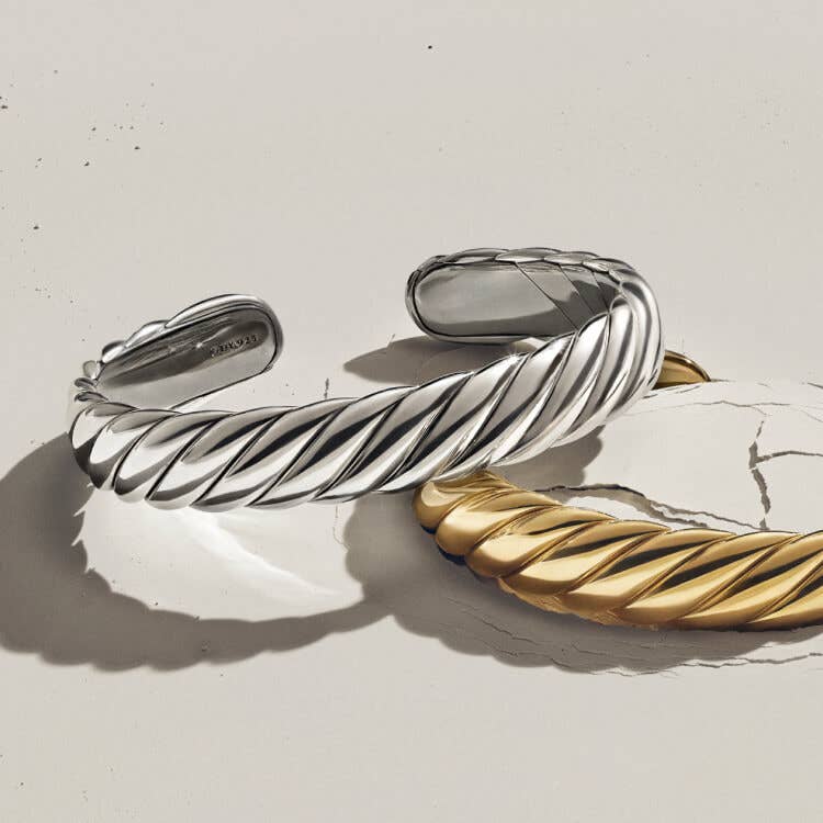 Two David Yurman Sculpted Cable bracelets.