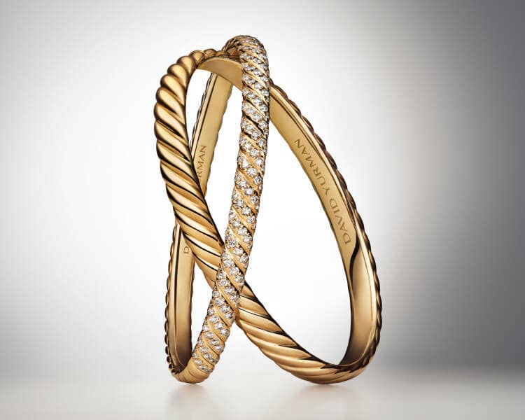 An image of two David Yurman Sculpted Cable bangles.