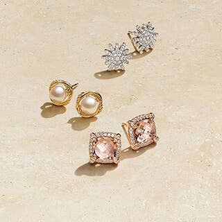Three pairs of David Yurman stud earrings with and pearls and stones.