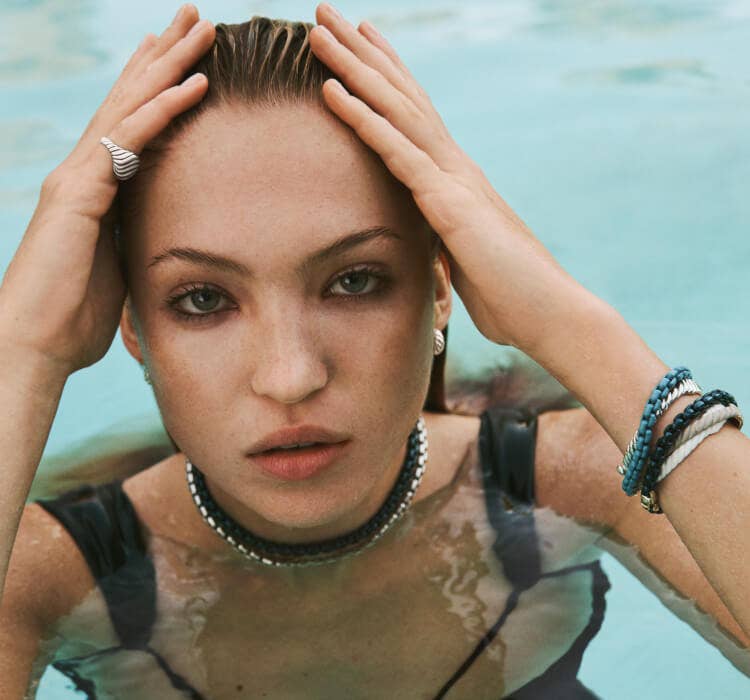 An image of Lila Moss wearing sculpted cable and bel aire.