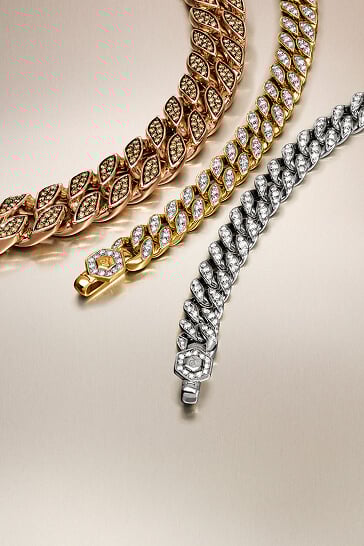 Three David Yurman curb chain necklaces for men.