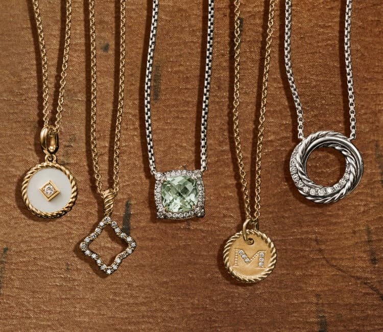 An image of seven pendant necklaces for women.