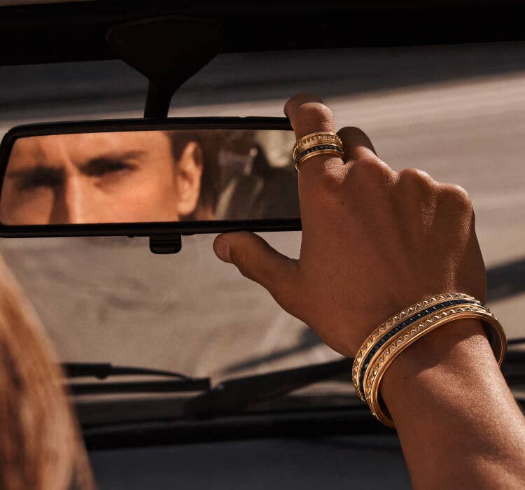 An image of James Turlington wearing David Yurman Pyramid.