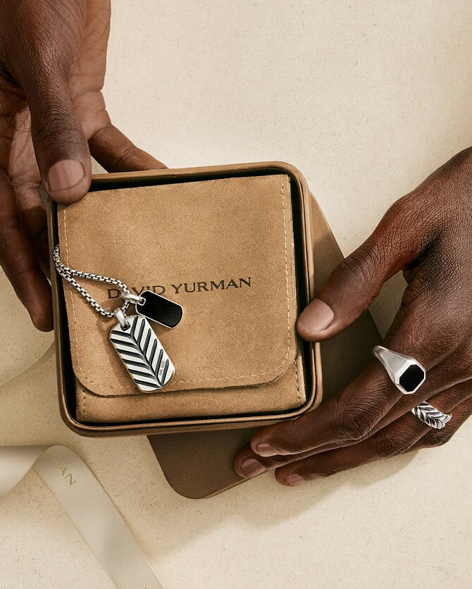 A man wearing David Yurman rings.