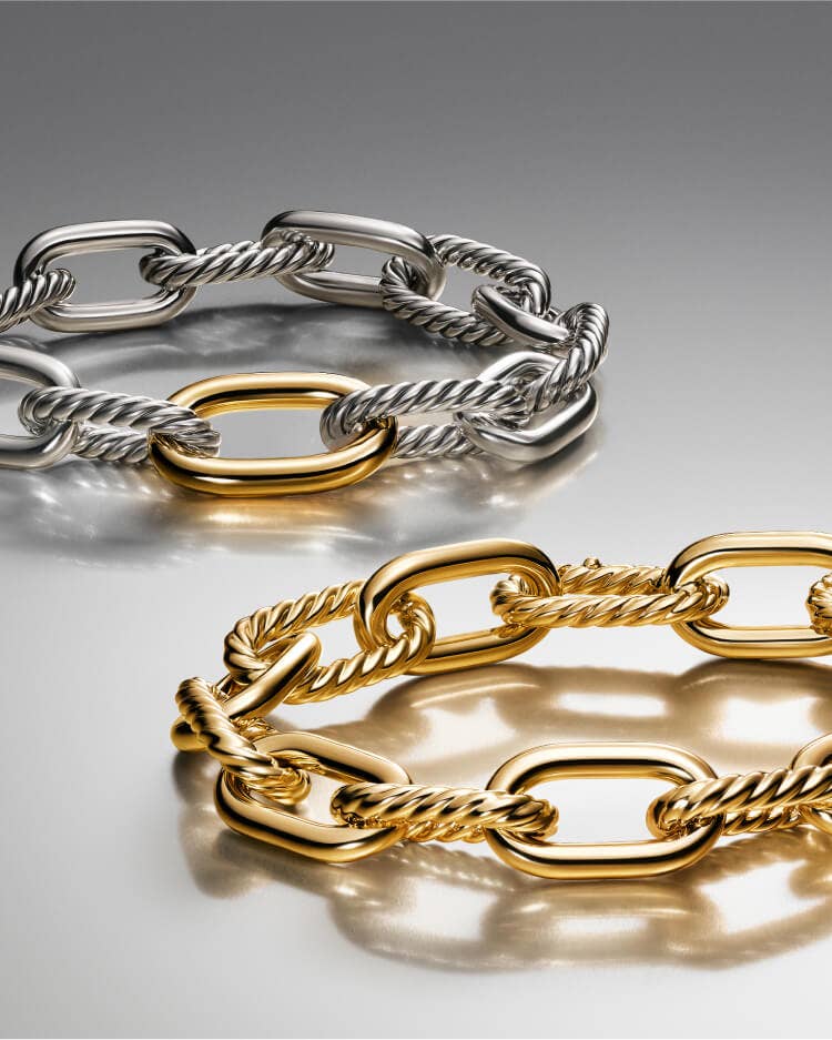 Two David Yurman Madison bracelets in gold and silver.