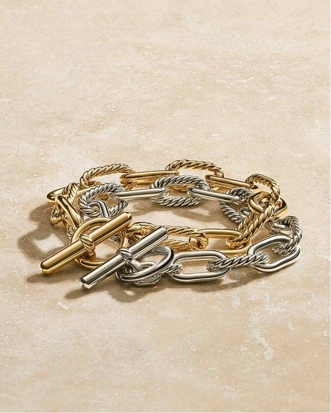 A gold and a silver DY&#174; Madison Toggle Bracelet. 