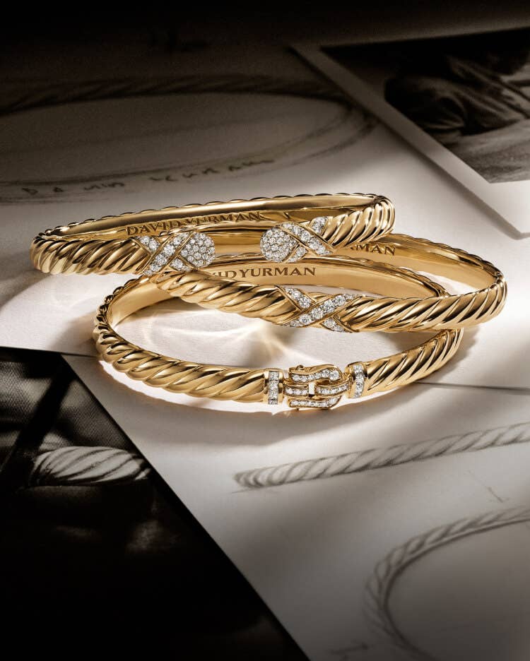 Three David Yurman Sculpted Cable bracelets.