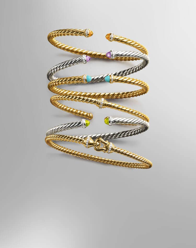 Six David Yurman cable bracelets for women.