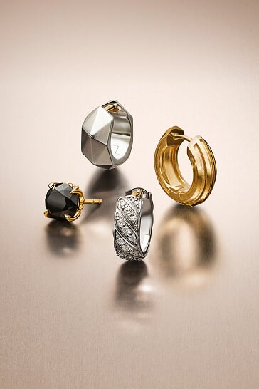 Three David Yurman cuff bracelets for men.