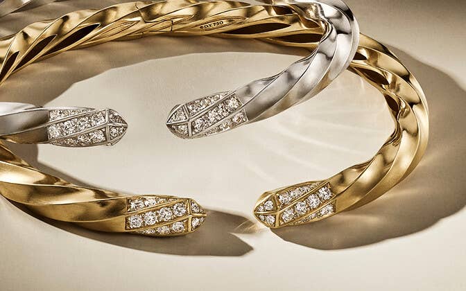 One silver and one gold 5mm Cable Edge&#174; Bracelet with diamonds.