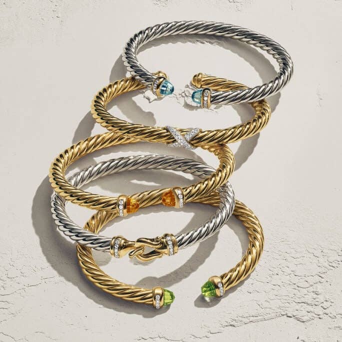 David Yurman cable bracelets in various metals and gemstones.
