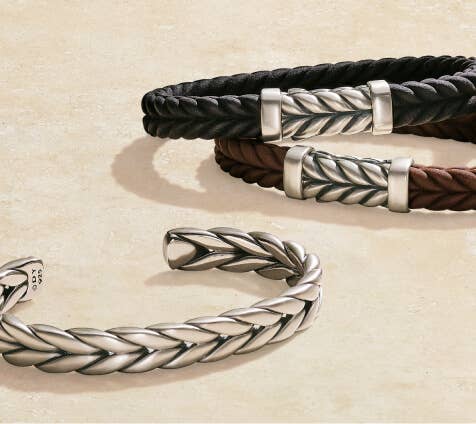 A collection of 3 David Yurman men's bracelets, featuring Chevron and rubber styles.