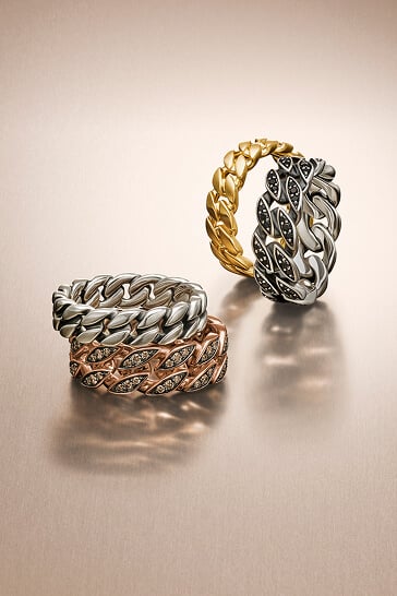 Three David Yurman cuff bracelets for men.