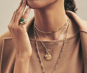 Model wearing David Yurman necklaces.