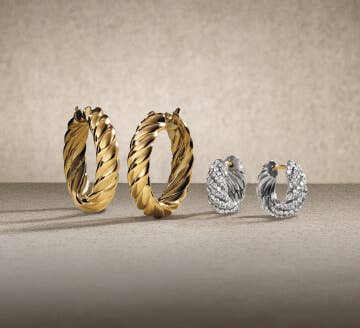 Three David Yurman Sculpted Cable hoop earrings.
