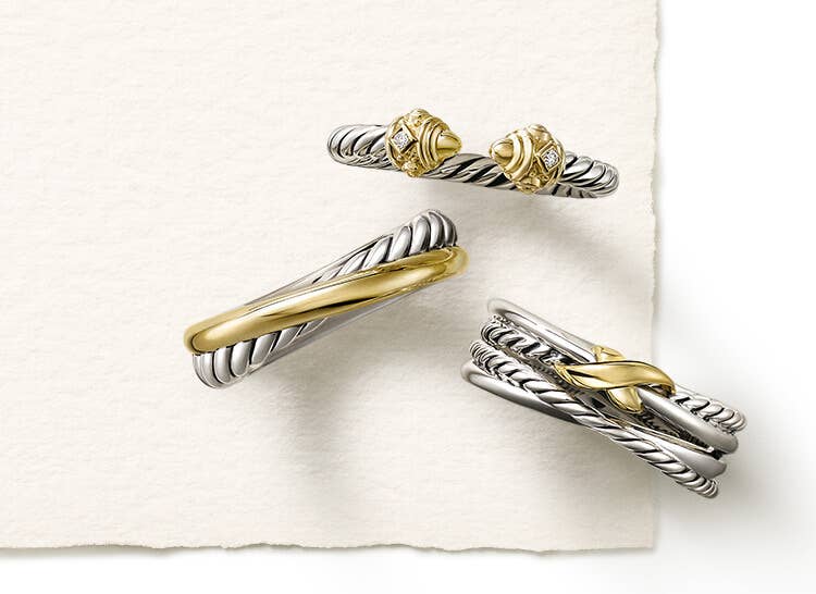 An image of three mixed metal petite rings in silver and gold.