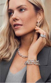 A mother wearing David Yurman bracelets and jewelry.