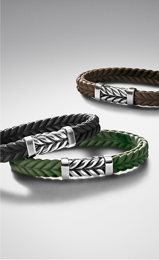 Three David Yurman bracelets.
