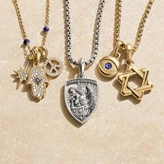 A variety of David Yurman spiritual amulets in silver and gold. 