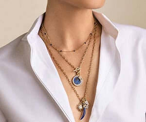 Model wearing David Yurman necklaces.