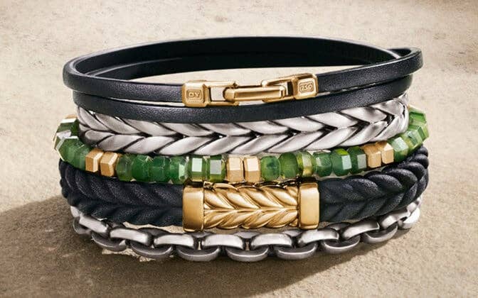 A mix of five David Yurman bracelets in a variety of materials and stones. 